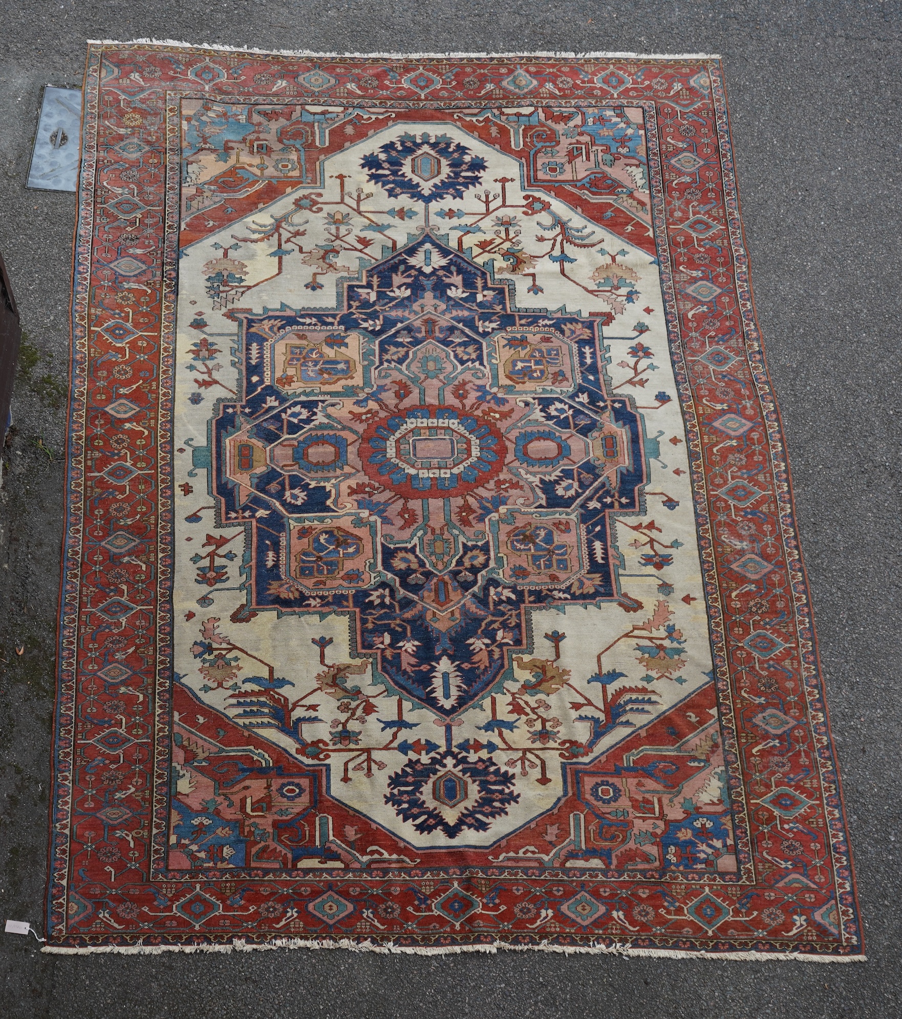 An early 20th century Heriz ivory ground carpet